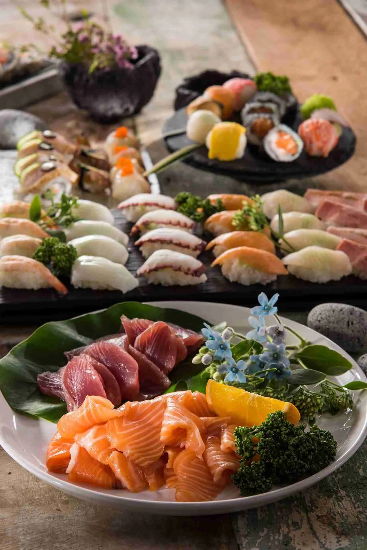 Raw fish sushi is very popular. What are the potential health benefits and risks of eating raw fish and how to keep it as safe as possible?